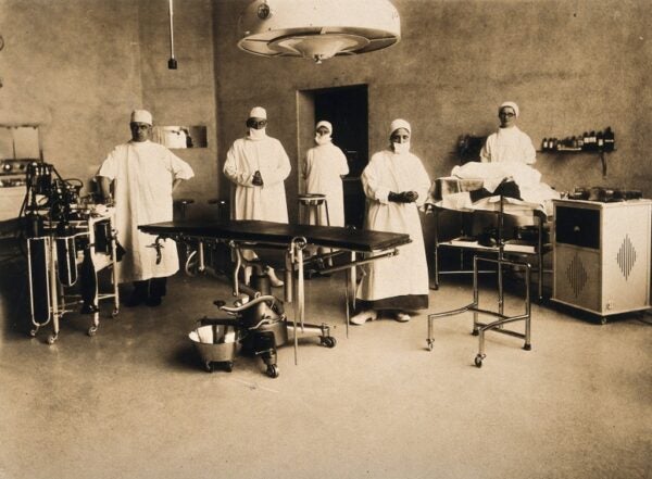 Surgical staff standing in an operating theatr