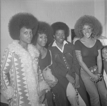 Willie Ford, Jr. Three women and a man sitting for a picture, ca. 1970-1976.