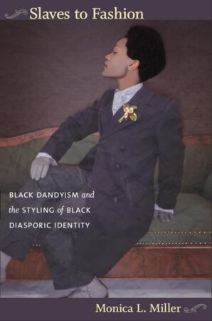 Book cover of Slaves to Fashion: Black Dandyism and the Styling of Black Diasporic Identity by Monica L. Miller. The cover features a stylishly dressed Black man in a double-breasted suit with a flower boutonnière, sitting on a vintage green couch in a confident, posed manner.