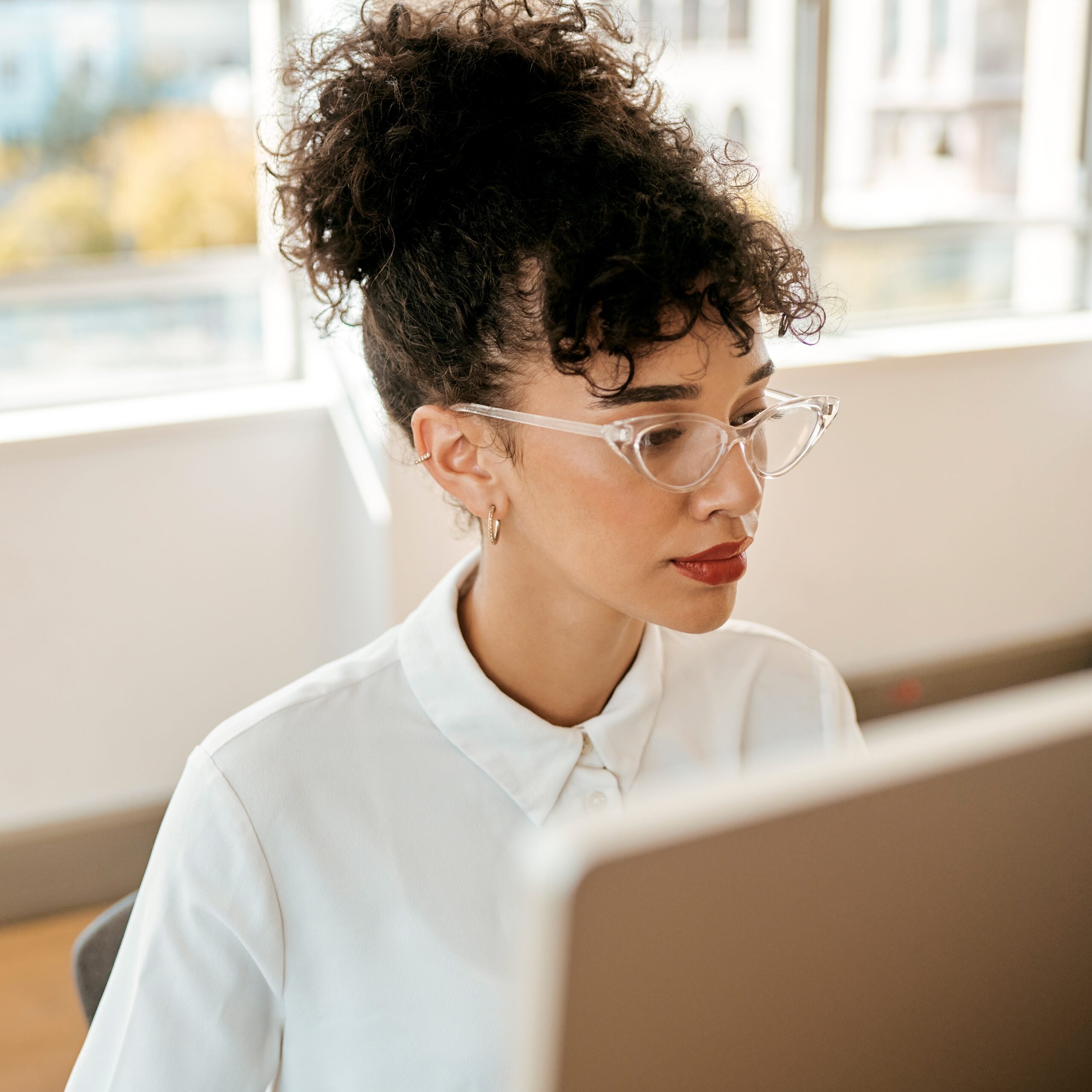 businesswoman working at computer in an office