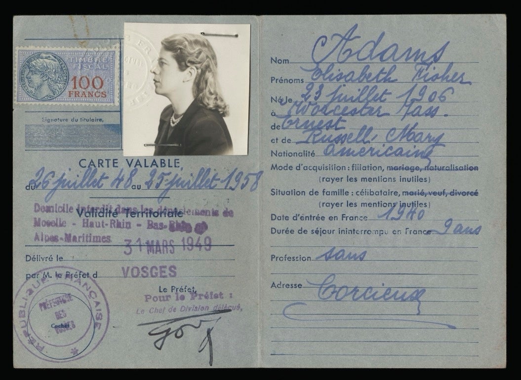 Blue French residence permit for Elisabeth Fisher Adams, with handwritten details, official stamps, and an attached profile photograph.
