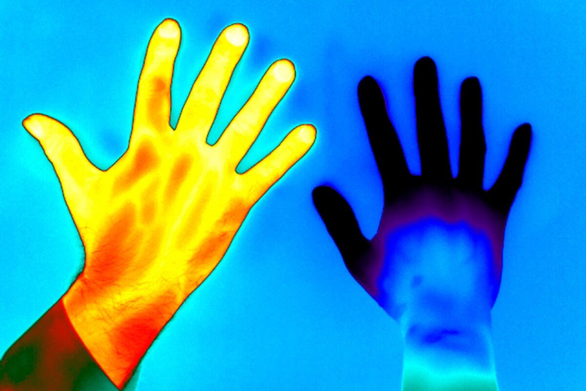 Thermal image showing two hands, one heat-mapped in bright yellow, orange, and red tones, and the other in cooler blue and purple tones, set against a blue background.